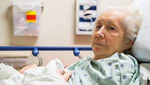 Elderly woman in Hospital Bed